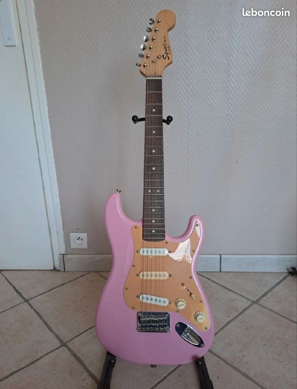 Guitare électrique rose/mauve (image 1)