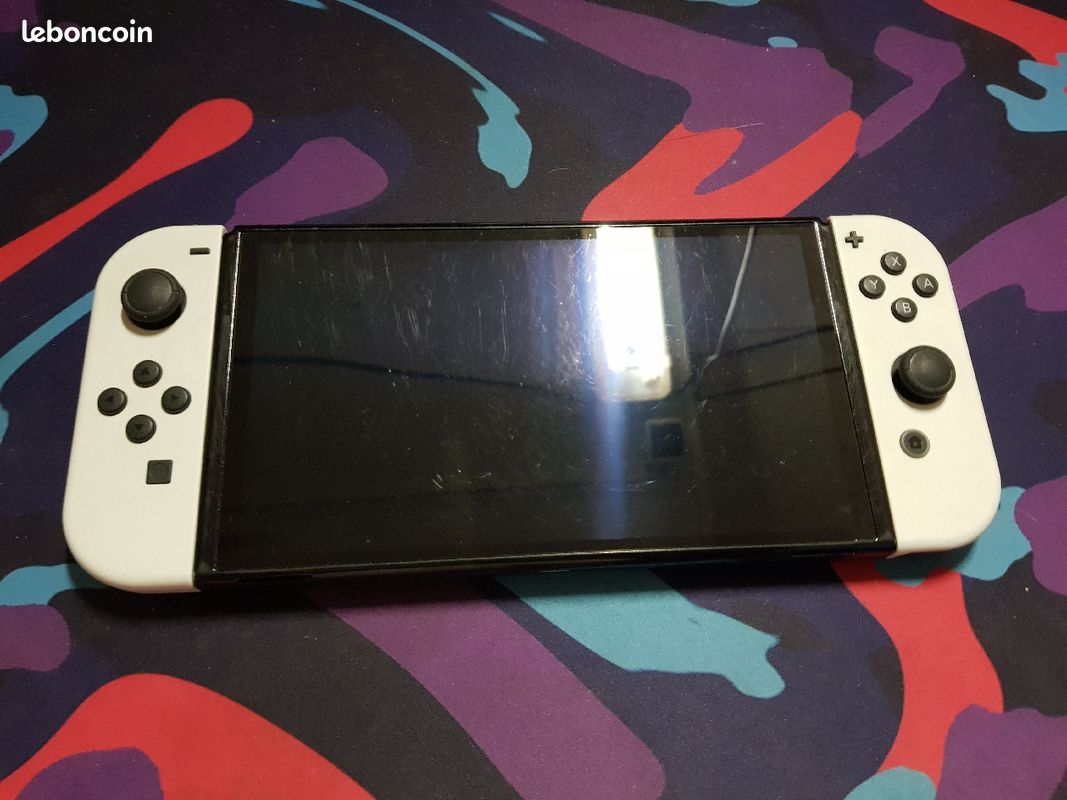 Switch oled + 6 jeux + manette pro. Pris negociable (image 1)