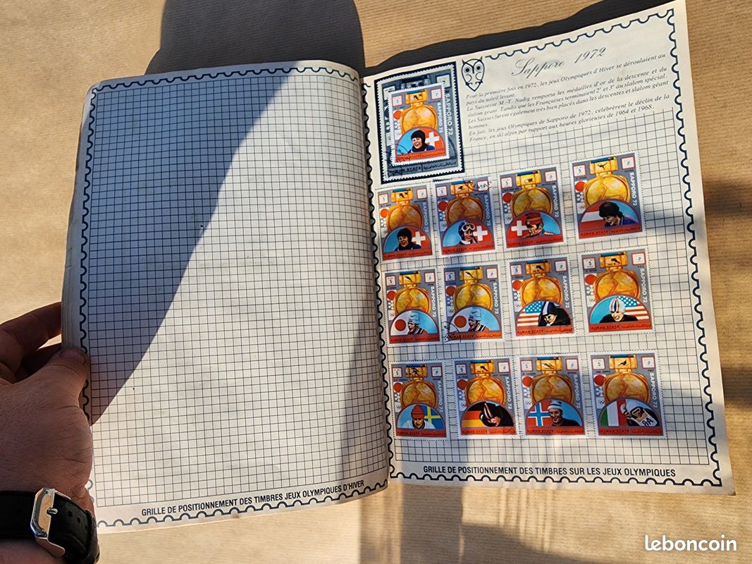 IMPACTO COLECCIONABLES – Collection 100 timbres sur le thème des Jeux olympiques avec album inclus (14x18x1cm) | Élevez votre collection philatélique avec des timbres, dans un album compact et élégant