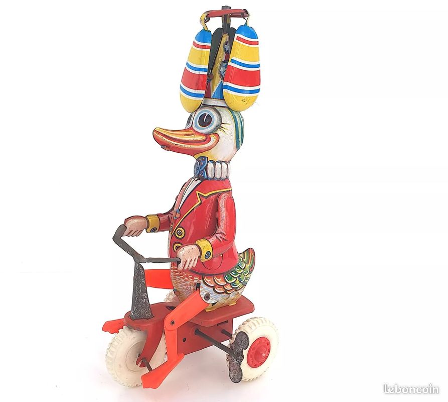 Ancien jouet mécanique en tôle, lithographie, cheval avec clown sur
