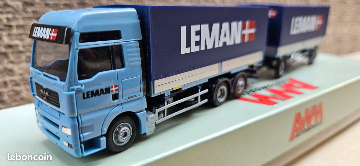 MAN TGA XXL + semi-rqe tautliner Trio Transport AS (DK