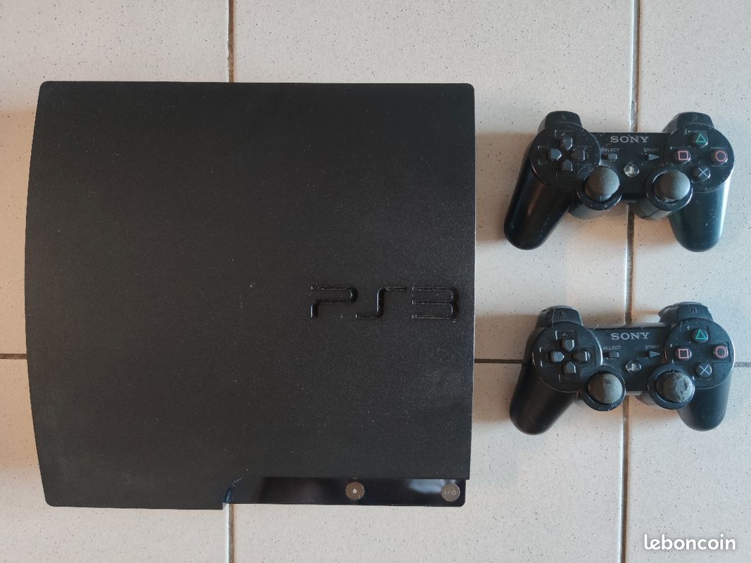 PS3 slim avec 2 manettes + 13 jeux (image 1)