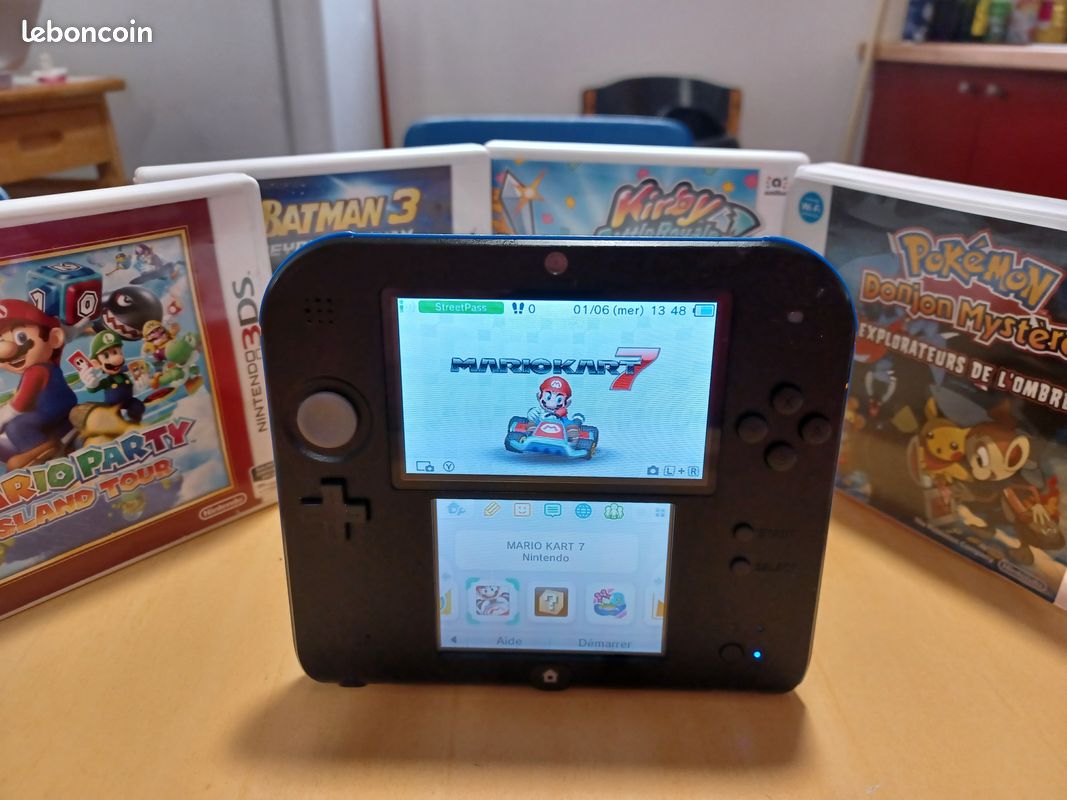 Nintendo 2ds +4 jeux+Mario kard sur ds (image 1)