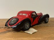 A photograph of a 1936 Bugatti Type 57 SC Atalante, a luxury grand