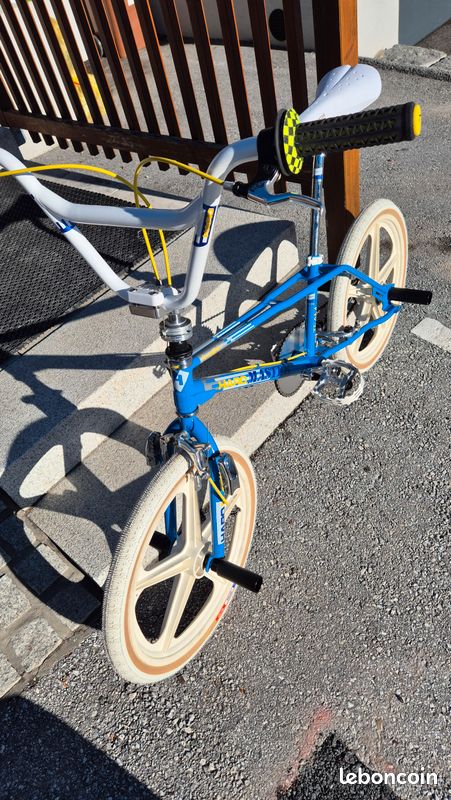 A bicycle rear derailleur ready to be installed onto a mountain bike