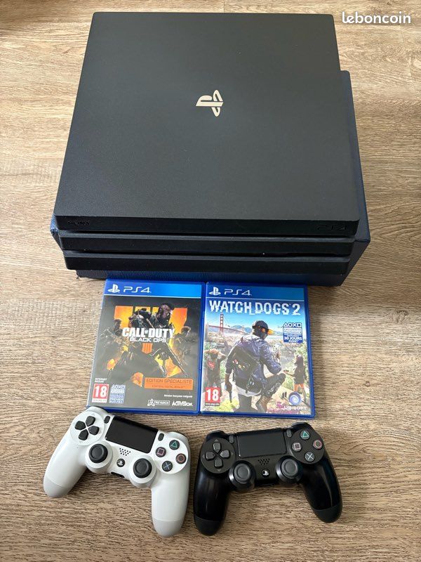 Console Sony PS4 Pro 1To Noire + 2 Jeux - Occasion Bon état