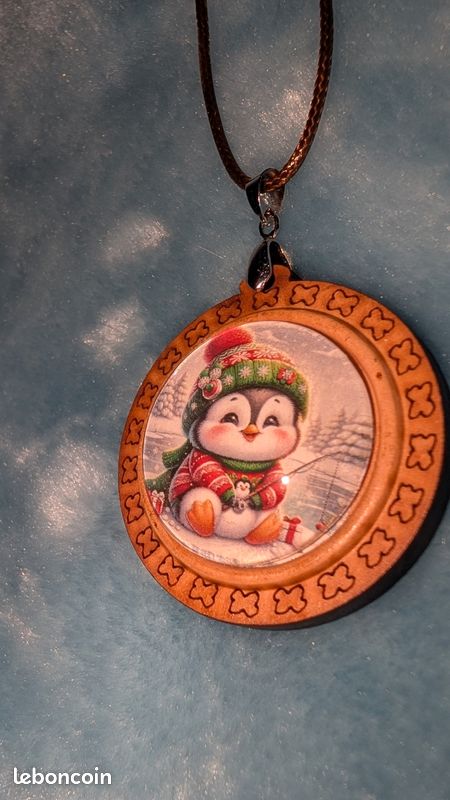 Collier bois thème pingouin (image 1)