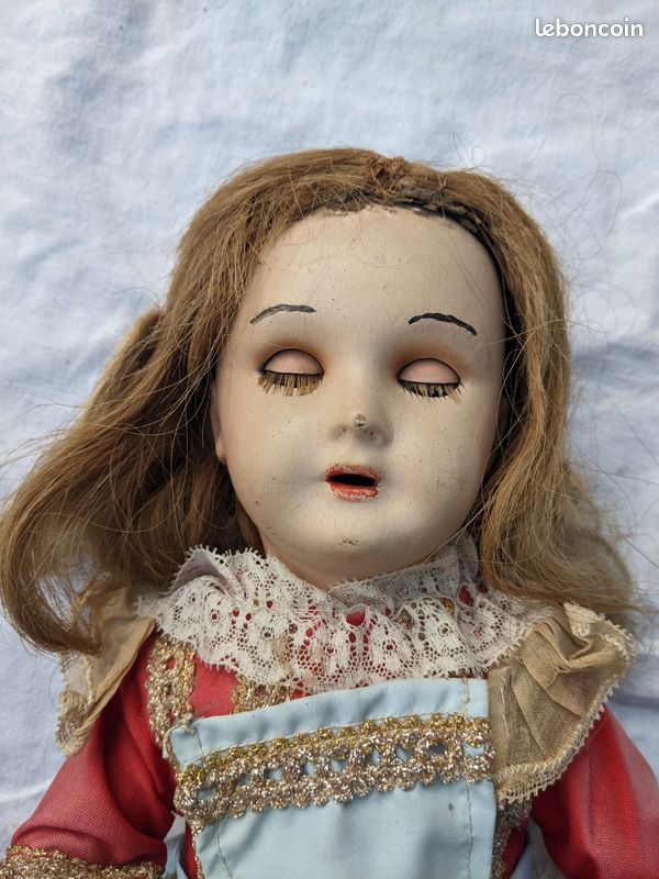 An early German papier-mâché Doll An early German papier-mâché Doll