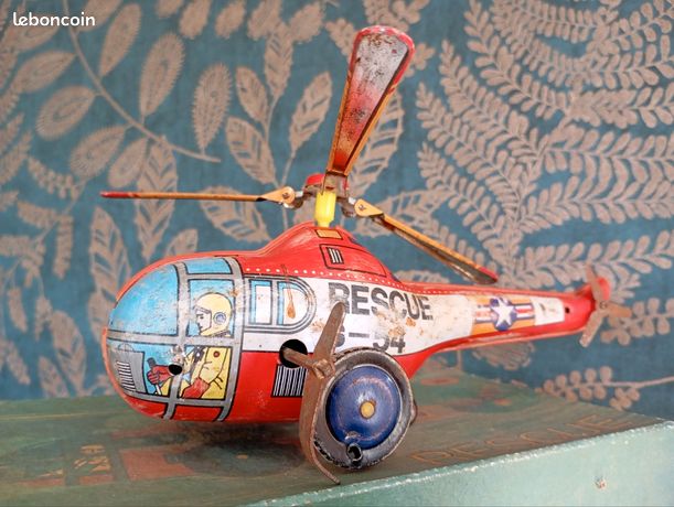 Ancien jouet mécanique hélicoptère en tôle - France