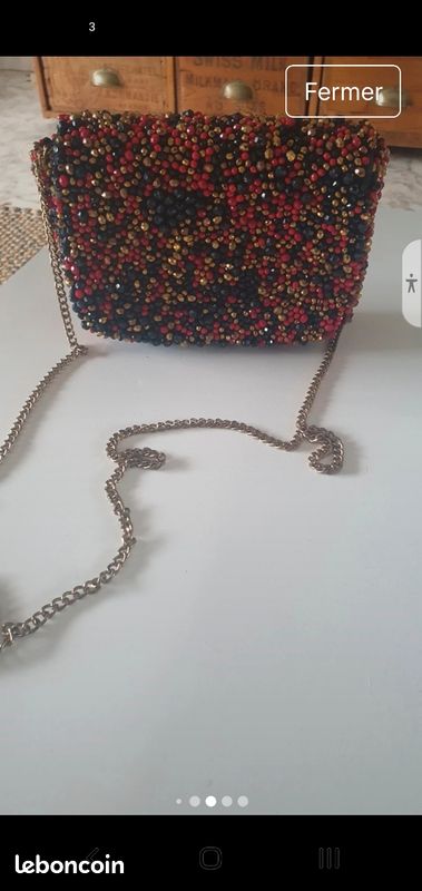 Vends sac de luxe magnifique rouge, or ,noir marque 