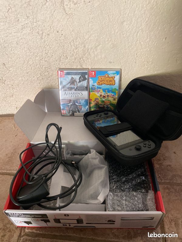 Nintendo switch neuve + housse de protection + 2 jeux (image 1)