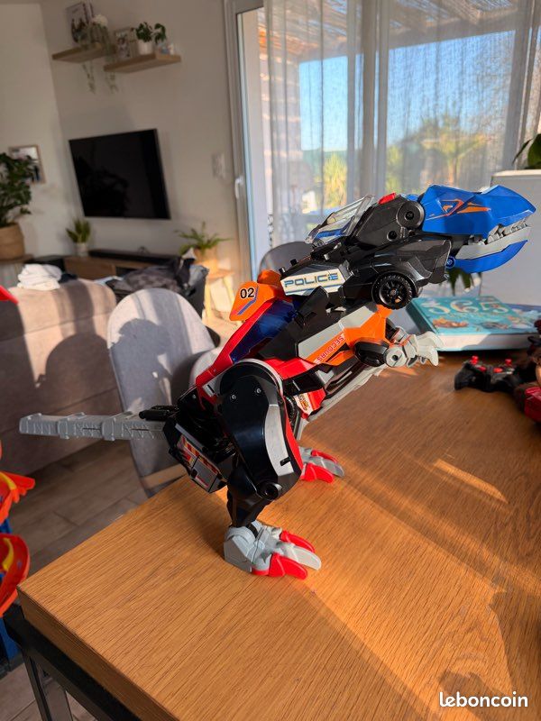 Vteck Switch & Go Dinos Combo, Dinosaure Sonore Trio, le Méga T-Rex SOS 3 en 1, Voiture de Police, Camion de Pompiers, Hélicoptère, Jouet Dino Articulé V-tech (image 1)