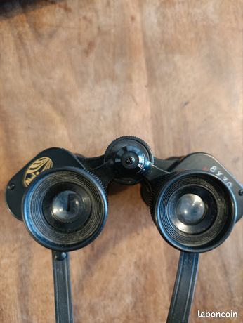 A pair of Frank Nipole 8x30 binoculars; together with a pair of