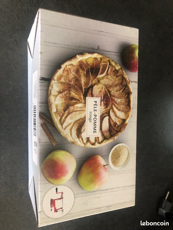 Pèle-pomme rouge neuf (image 1)