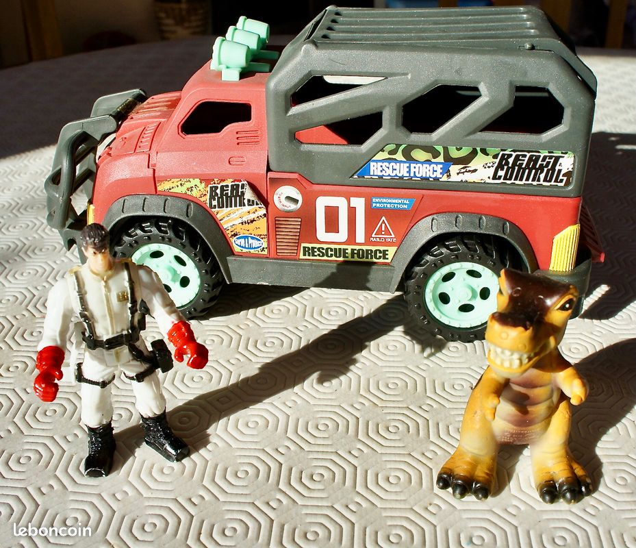Camion transport dinosaure + dinosaure + personnage + armes (image 1)