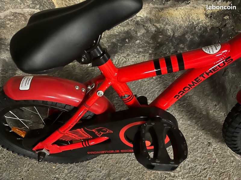 Vélo enfant PROMETHEUS 14 pouces avec roulettes – Rouge (3 à 5 ans) - Vélos Vélo enfant PROMETHEUS 14 pouces avec roulettes – Rouge (3 à 5 ans) - Vélos