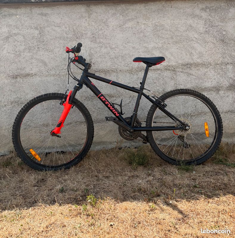 Btwin vtt 24" rockrider 500 orange avec porte bidon (image 1)