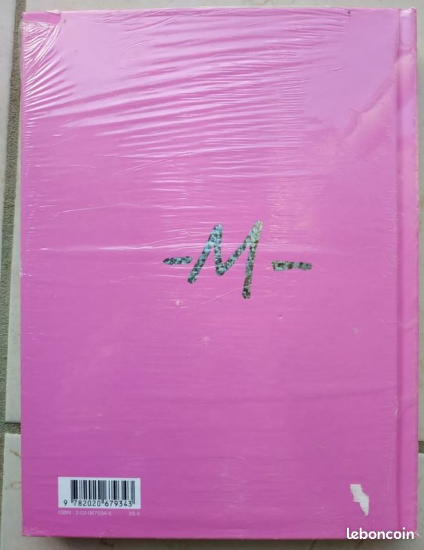 Livre "Le monde de M" (neuf sous blister) (image 2)