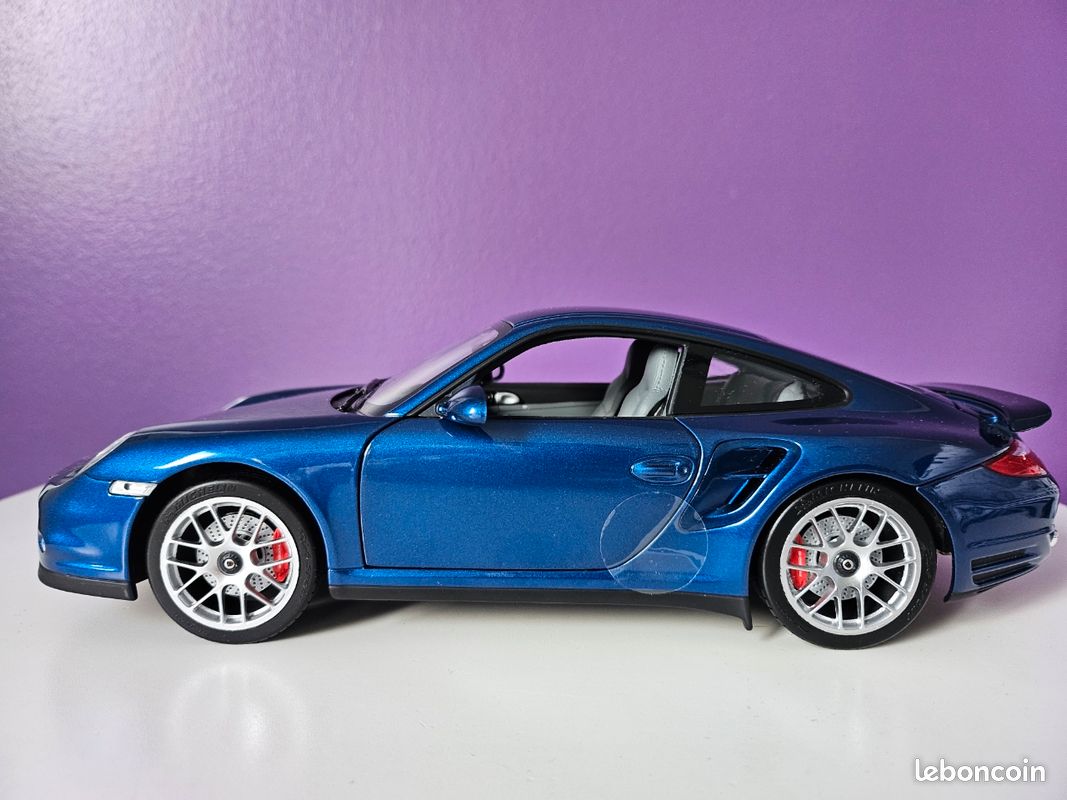 Miniature Norev 1/18 Porsche 911 Turbo 2010 – Gris Métallisé – Occasion