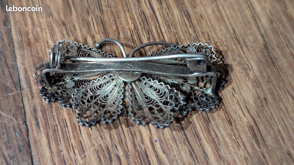 Broche antique en argent 835 en fil d'argent filigrane floral