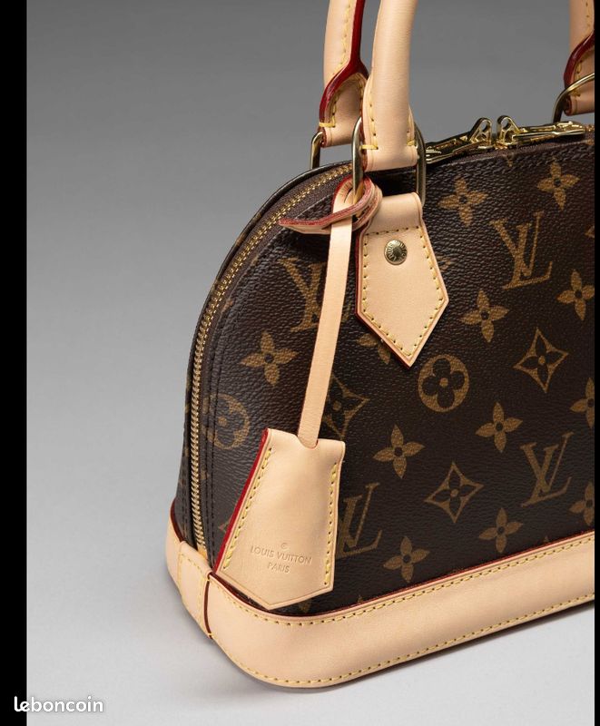 Sac 'Alma BB' 24 cmDE Louis VUITTON en toile Monogram et cuir
