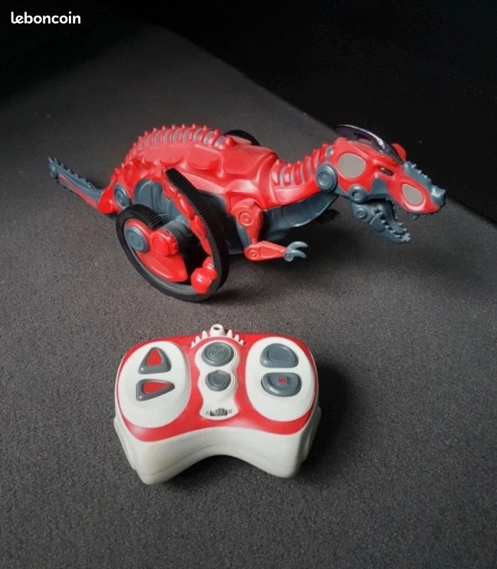 Dinosaure robot télécommandé roulant rouge (image 1)