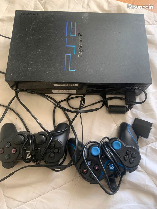PS2 avec 6 jeux (image 1)