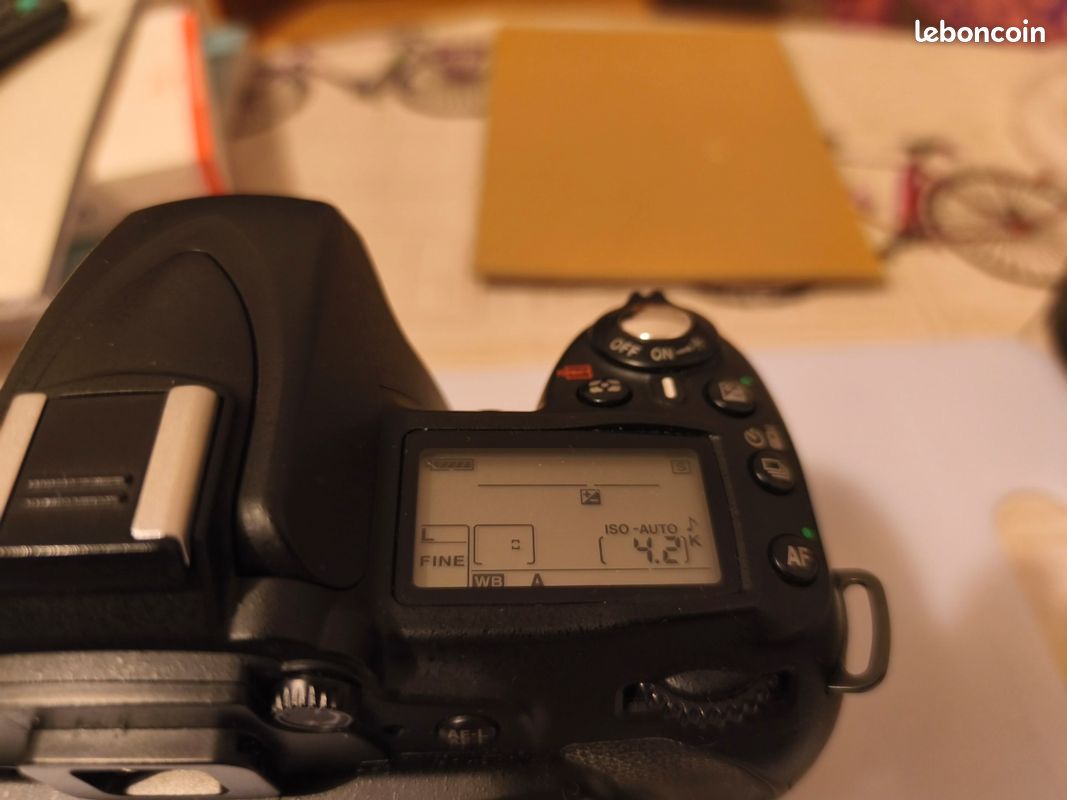 Nikon D90 body with two lenses, battery grip and batteries- as is for parts