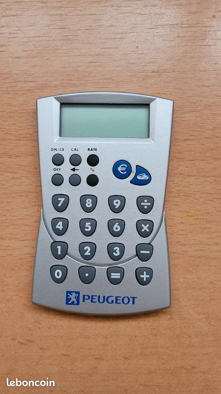 Calculatrice grise Peugeot convention des francs en euros 9,5cmx6cm (image 1)