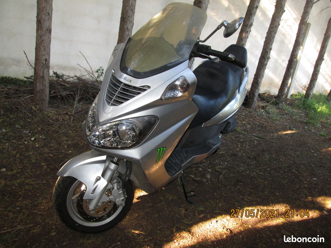 échange scooter 125 daelim contre quad (image 3)