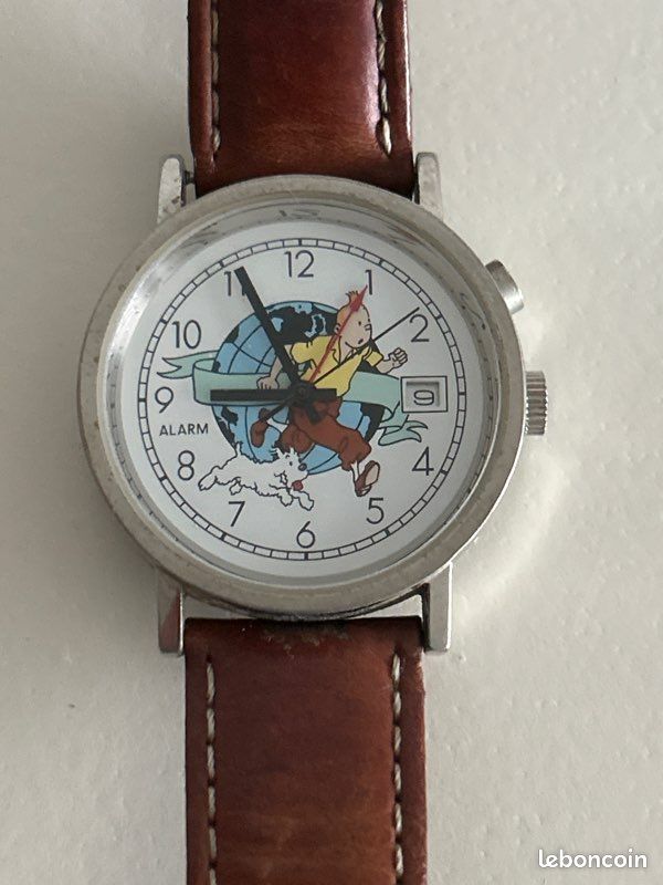 Tintin - 1 Tintin présentoir Citime avec Montre Tintin sur La Lune
