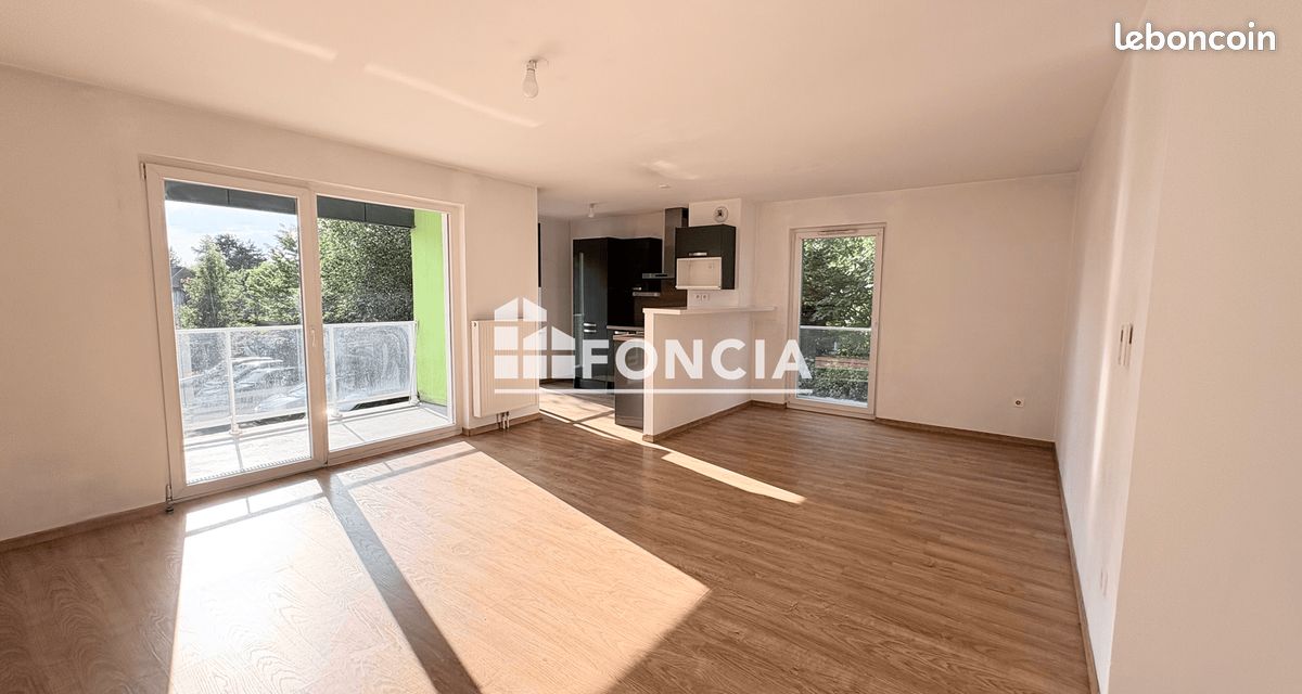 Appartement T3 avec balcon et parking privatif (image 1)