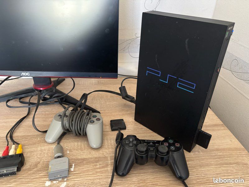 Vente ps2 avec 2 manette avec tout les câble nécessaire (image 1)
