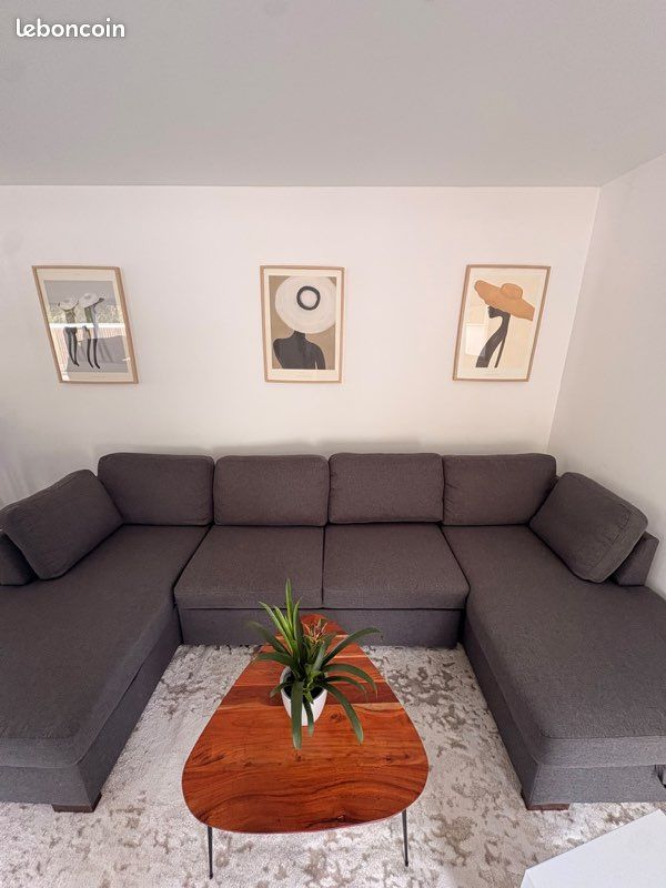Titre : Canapé panoramique convertible 7 places gris – Maisons du Monde (image 1)