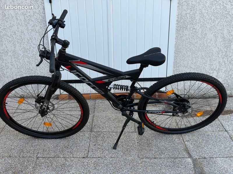VTT licorne strong quasi neuf 26' suspension intégrale et frein à