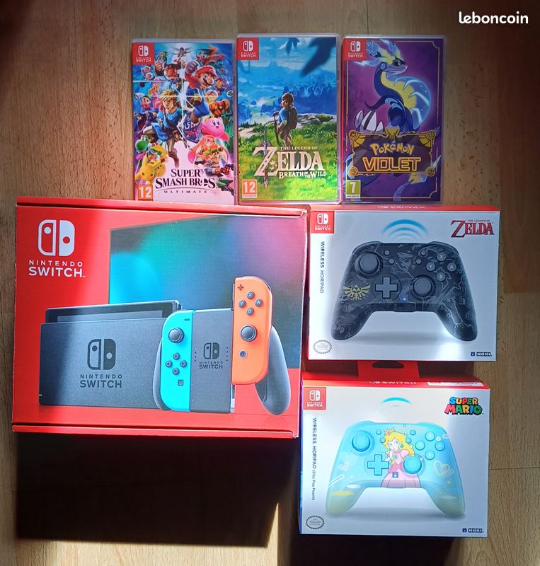 Pack Totalement neuf Nintendo Switch + 3 jeux (Zelda BOTW, Pokémon Violet, Mario smash brss ultimate) +2 manettes Hori (image 1)