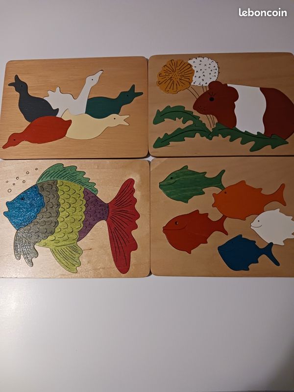 Quatre puzzles en bois (image 1)