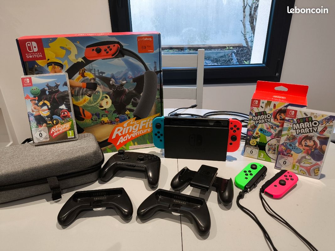 Nintendo Switch + manette pro + 2 jeux + accessoires et sacoche (image 1)