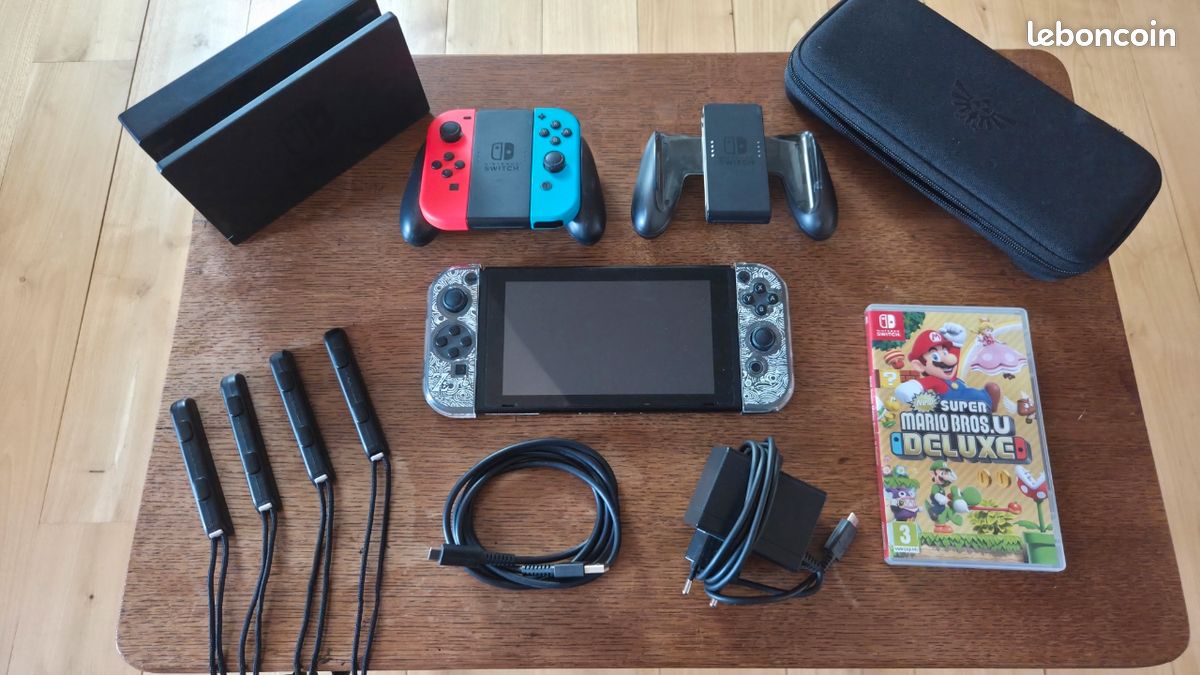 Lot Nintendo Switch avec joycons, housse et protection Zelda, dock, jeu et cables (image 1)