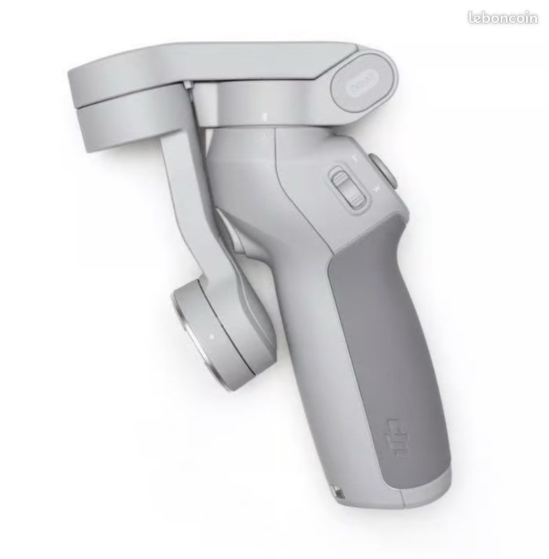 Stabilisateur DJI OM5 pour smartphone avec mini trépied de table (image 1)