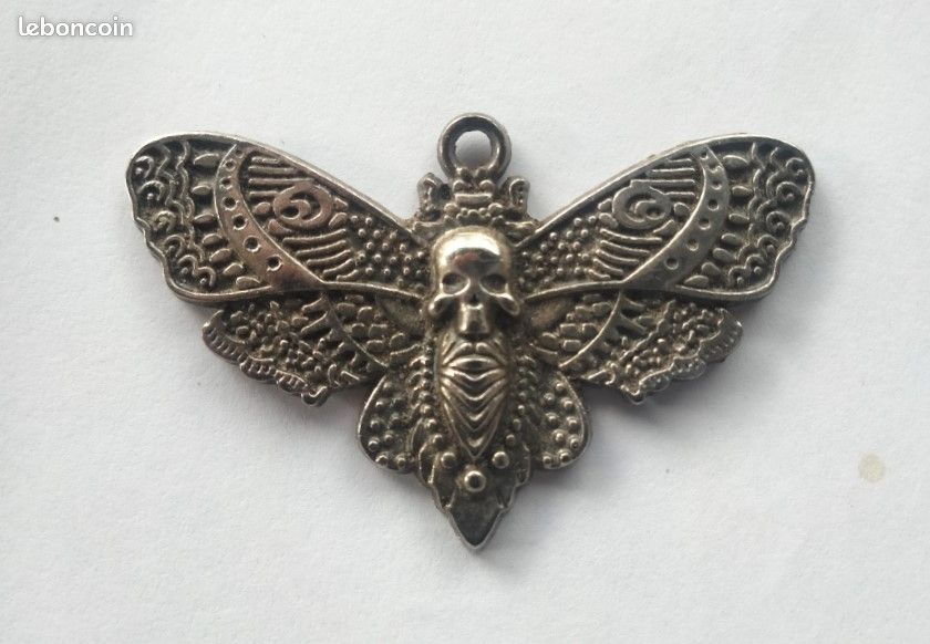 Médaille en forme de papillon (image 1)